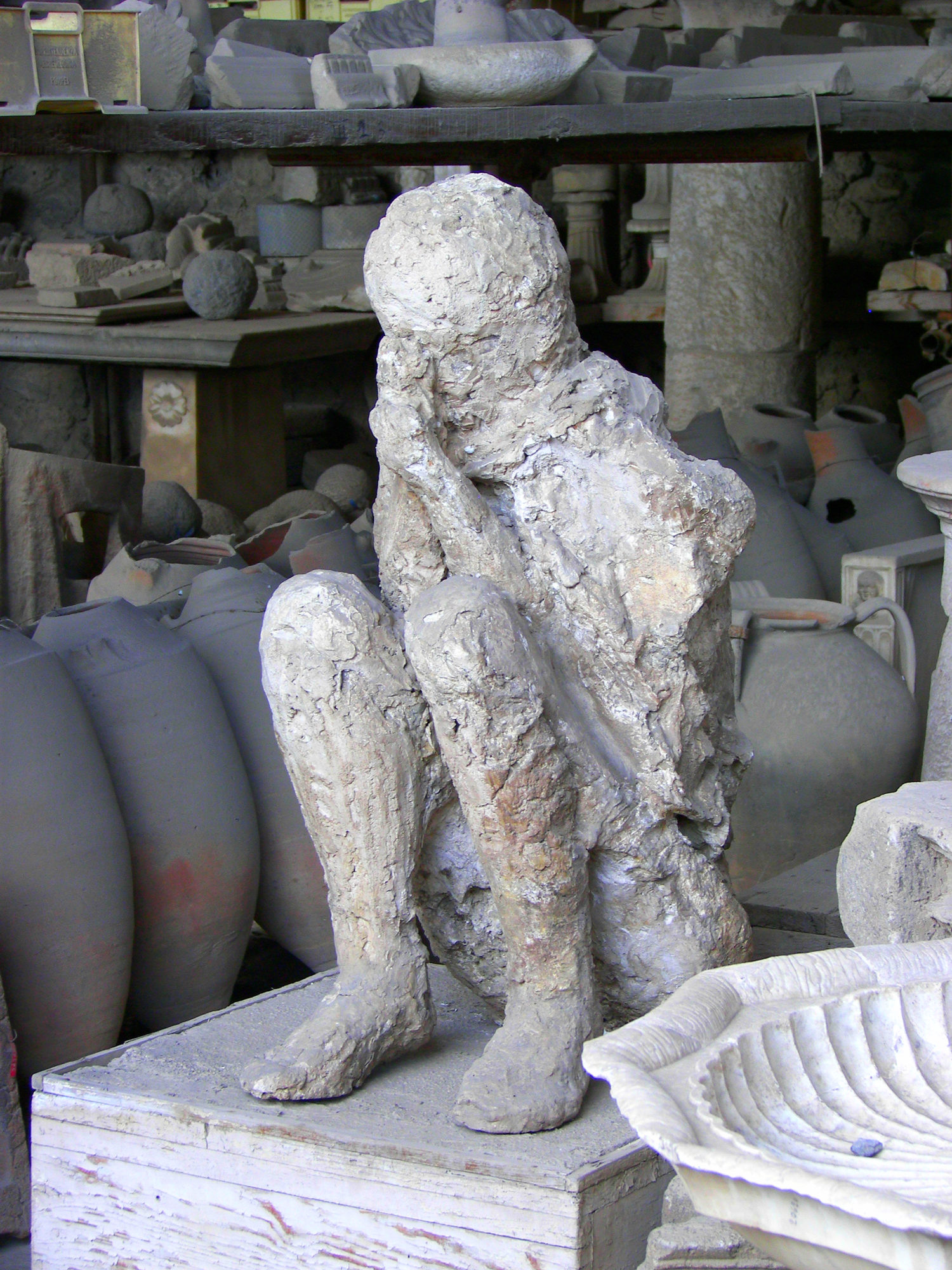 Plaster cast of a deceased person in the forum granary market in Pompeii